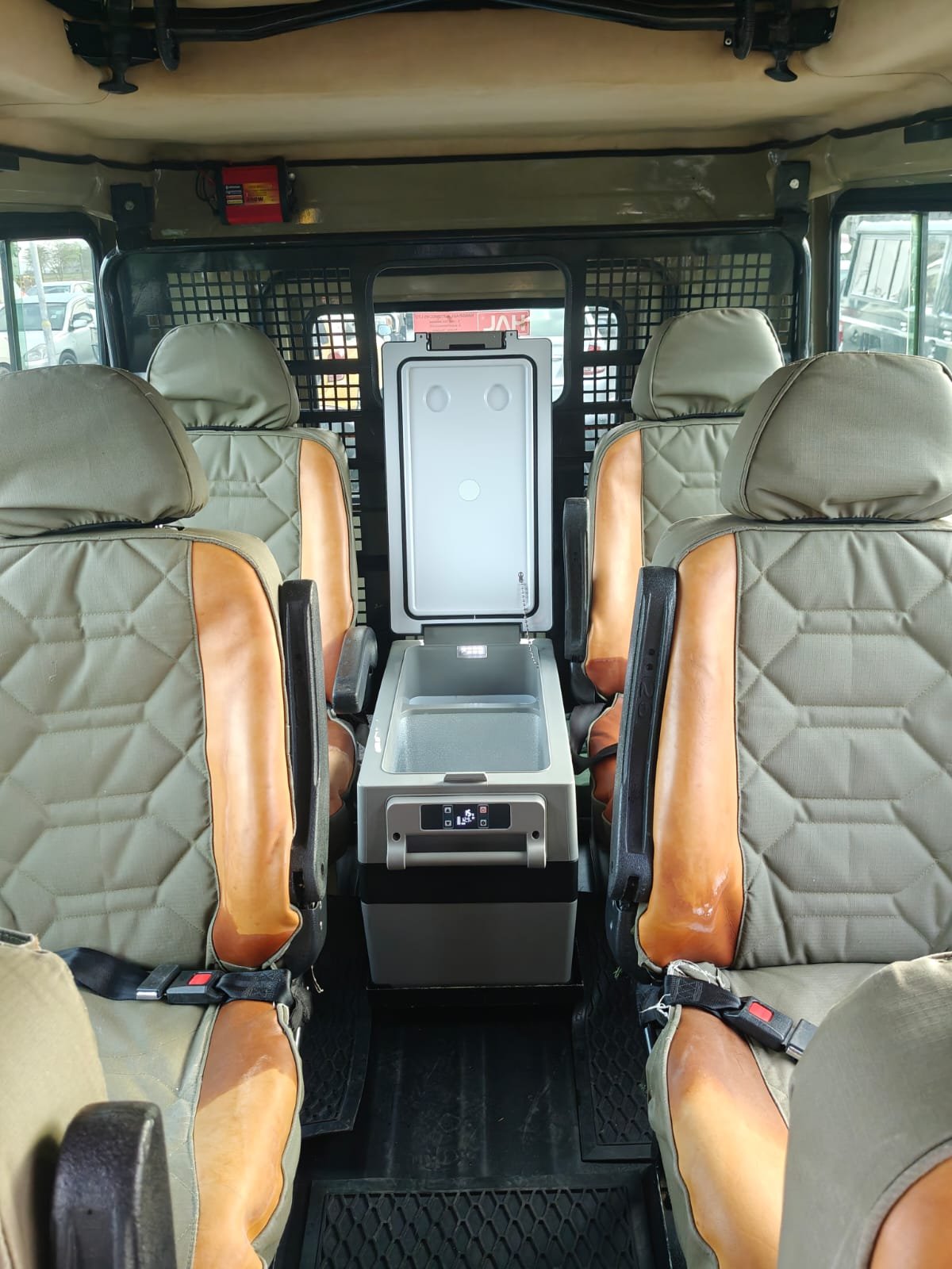 Inside our safari Land Cruiser — leather seats and on-board cool box